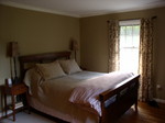 Master Bedroom w/ bed against new wall